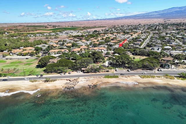 aerial view featuring a water and mountain view