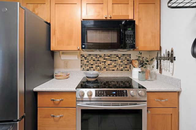 kitchen featuring decorative backsplash and stainless steel appliances