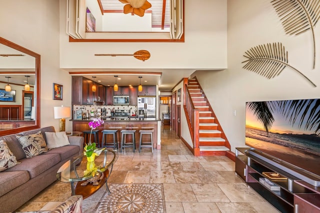 living room with a towering ceiling