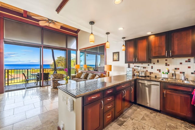 kitchen featuring a water view, stainless steel dishwasher, kitchen peninsula, pendant lighting, and backsplash