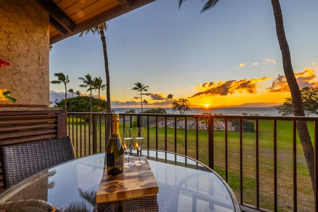 balcony at dusk with a water view