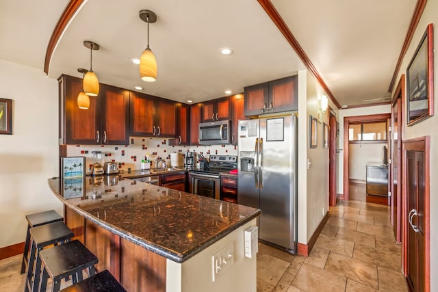 kitchen with kitchen peninsula, decorative light fixtures, backsplash, appliances with stainless steel finishes, and dark stone countertops