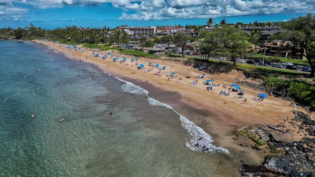 bird's eye view with a water view and a view of the beach