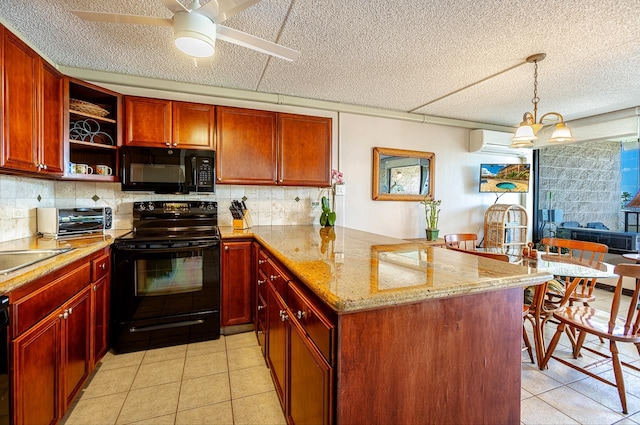 kitchen featuring ceiling fan with notable chandelier, kitchen peninsula, black appliances, a wall unit AC, and light tile floors