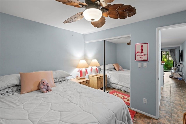 bedroom featuring a closet, baseboards, and a ceiling fan