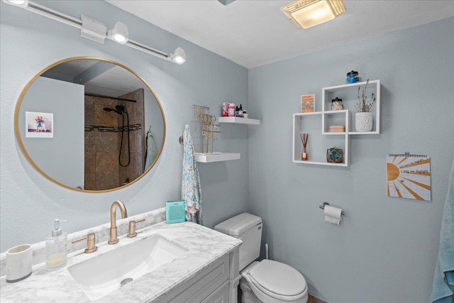 full bath with vanity, toilet, and a shower