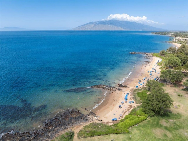 bird's eye view with a beach view and a water and mountain view