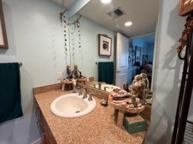 44 Kanani Rd Unit 1-104, Kihei, HI 96753 - bathroom featuring vanity and recessed lighting