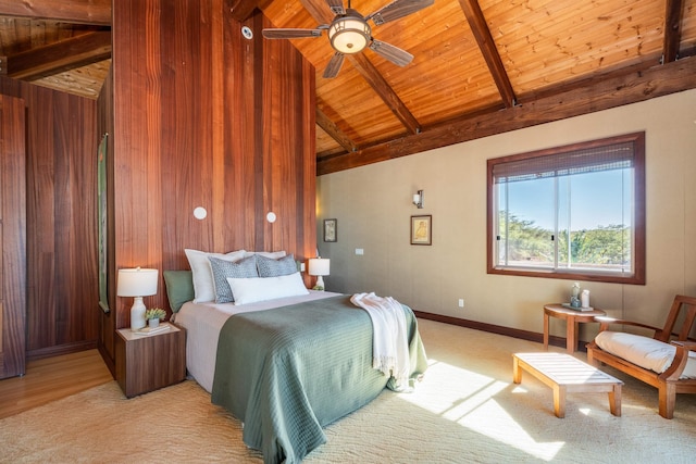 bedroom with light carpet, ceiling fan, wooden ceiling, vaulted ceiling with beams, and wood walls