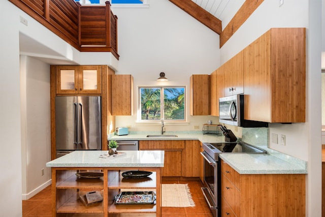 kitchen featuring beamed ceiling, sink, stainless steel appliances, and high vaulted ceiling