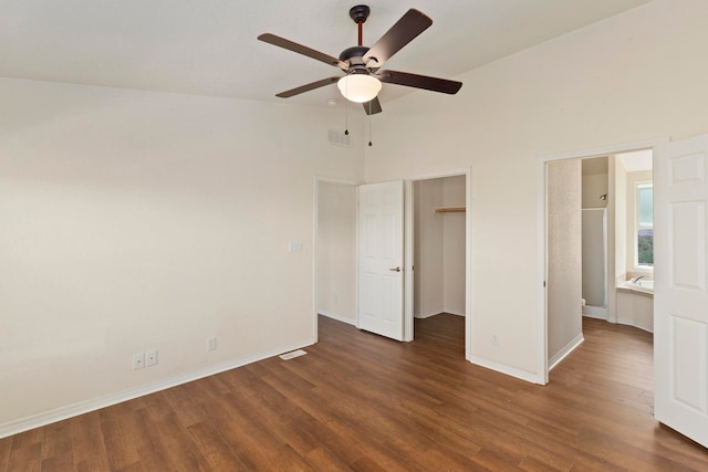 unfurnished bedroom with ceiling fan, dark hardwood / wood-style flooring, and high vaulted ceiling