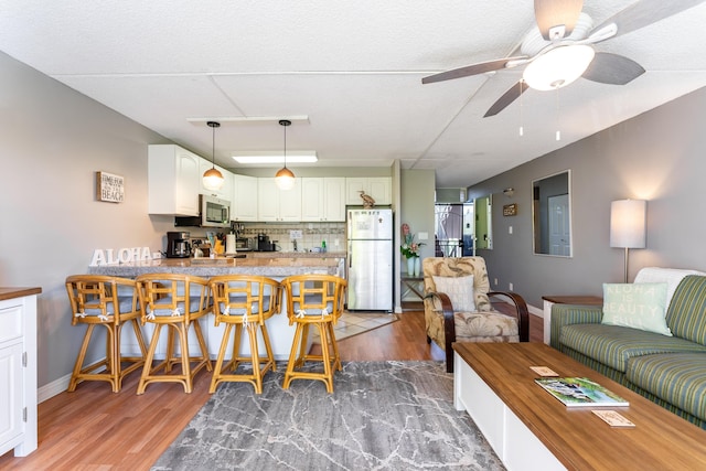 interior space with hardwood / wood-style flooring and ceiling fan