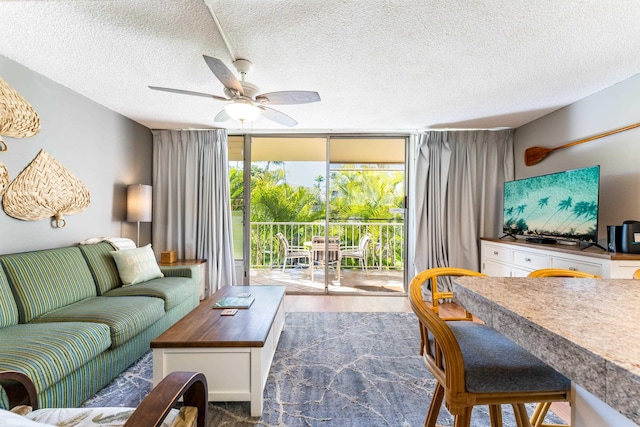 living room with floor to ceiling windows, dark wood-type flooring, a textured ceiling, and ceiling fan