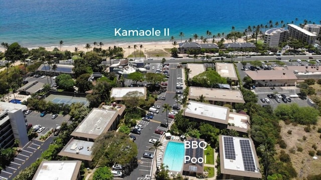 birds eye view of property featuring a water view and a view of the beach