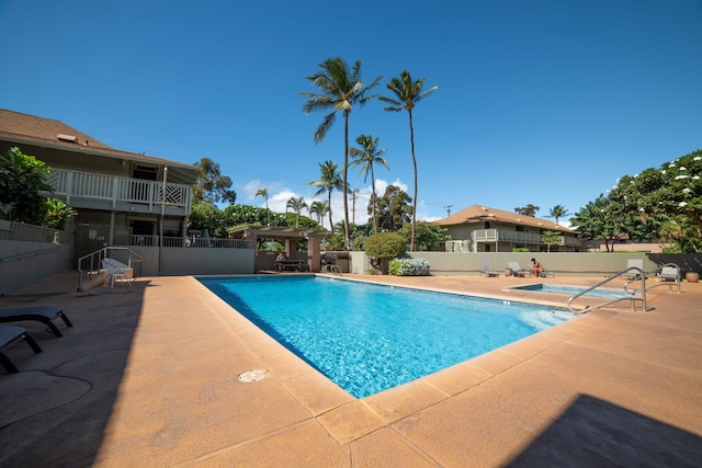 view of swimming pool with a patio area and a pergola