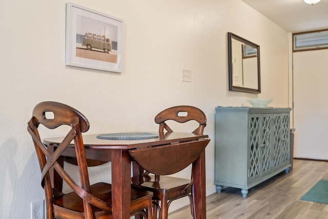 dining area featuring wood-type flooring