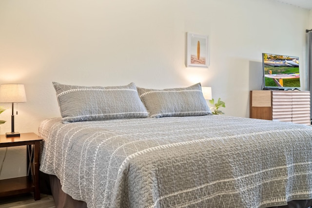 bedroom with wood-type flooring