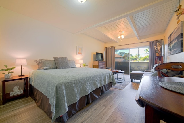 bedroom featuring beamed ceiling, wooden ceiling, hardwood / wood-style floors, and access to outside