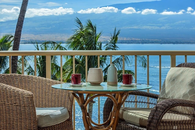 balcony featuring a water view