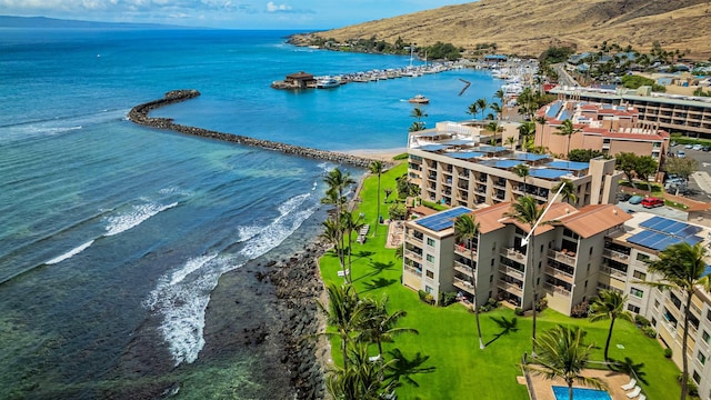 aerial view with a water view and a view of the beach