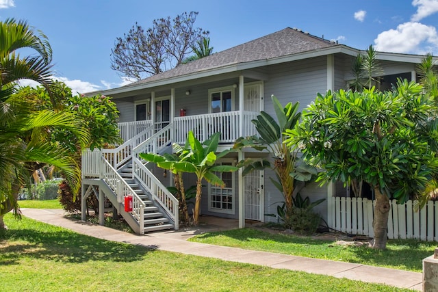 160 Keonekai Rd Unit 11-201, Kihei, HI 96753 - view of front facade with roof with shingles, covered porch, and stairway