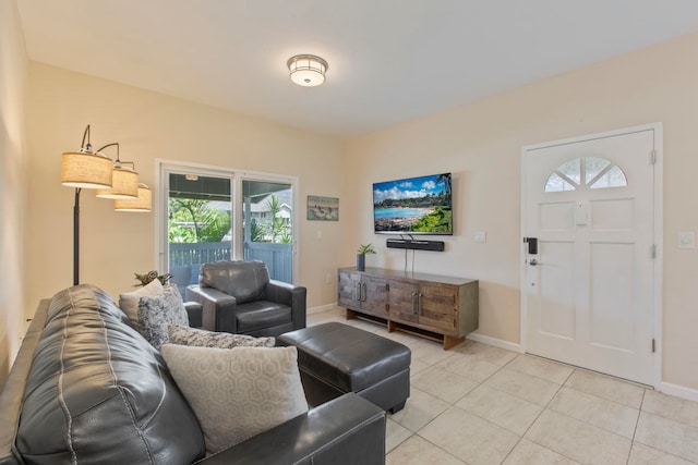 160 Keonekai Rd Unit 11-201, Kihei, HI 96753 - living area featuring light tile patterned floors, healthy amount of natural light, and baseboards