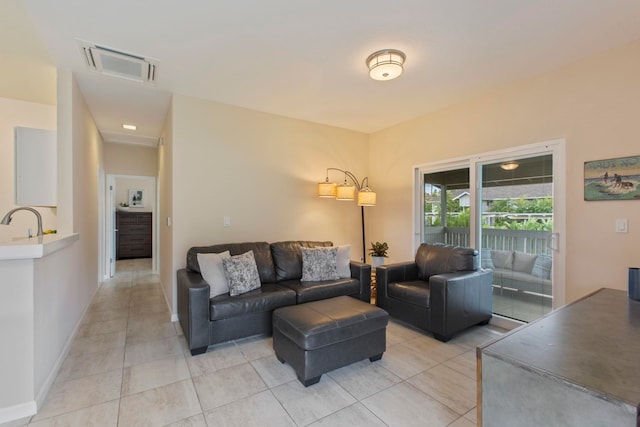 160 Keonekai Rd Unit 11-201, Kihei, HI 96753 - living room with light tile patterned flooring and baseboards