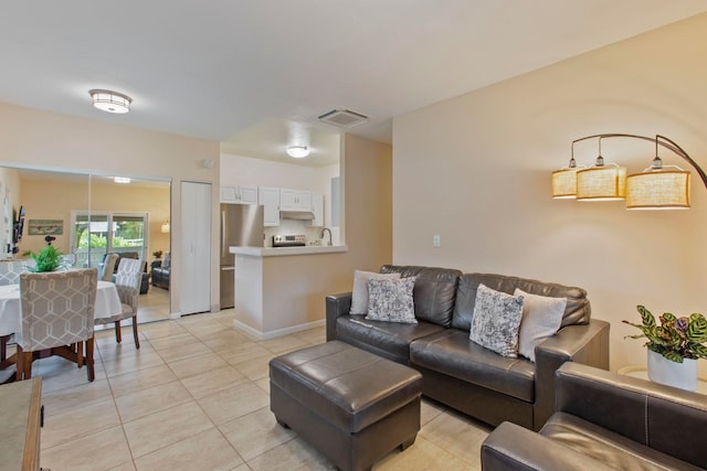 160 Keonekai Rd Unit 11-201, Kihei, HI 96753 - living area featuring light tile patterned flooring