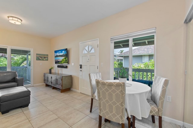 160 Keonekai Rd Unit 11-201, Kihei, HI 96753 - dining room featuring plenty of natural light, light tile patterned flooring, and baseboards