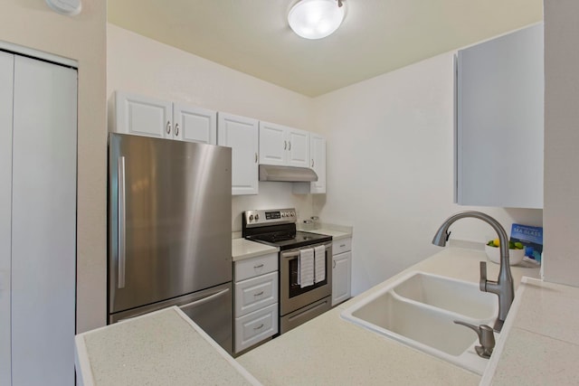 160 Keonekai Rd Unit 11-201, Kihei, HI 96753 - kitchen with stainless steel appliances, a sink, white cabinetry, under cabinet range hood, and light countertops
