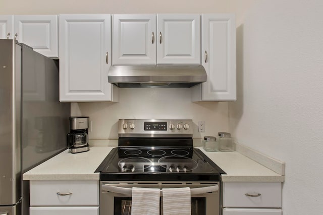 160 Keonekai Rd Unit 11-201, Kihei, HI 96753 - kitchen with stainless steel appliances, under cabinet range hood, white cabinetry, and light countertops