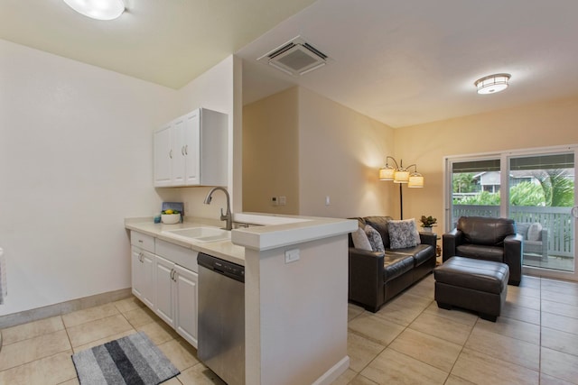 160 Keonekai Rd Unit 11-201, Kihei, HI 96753 - kitchen with stainless steel dishwasher, a sink, open floor plan, light tile patterned flooring, and white cabinets