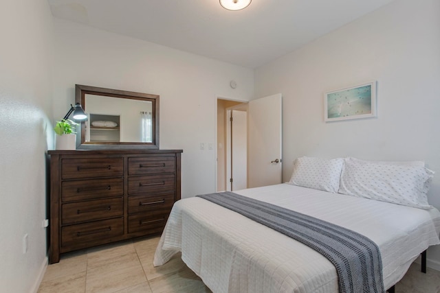 160 Keonekai Rd Unit 11-201, Kihei, HI 96753 - bedroom with baseboards and light tile patterned floors