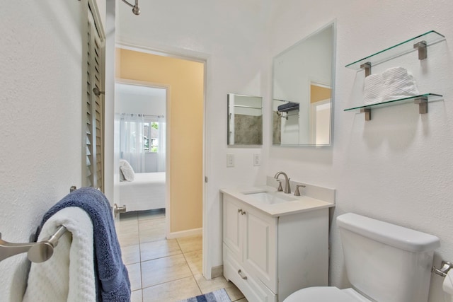 160 Keonekai Rd Unit 11-201, Kihei, HI 96753 - ensuite bathroom featuring vanity, toilet, and tile patterned floors