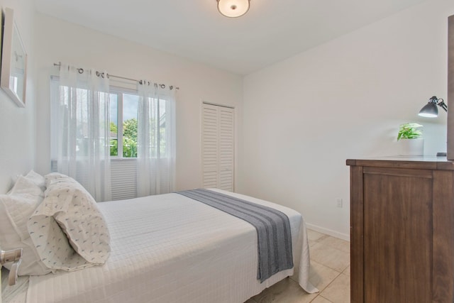 160 Keonekai Rd Unit 11-201, Kihei, HI 96753 - bedroom with light tile patterned floors and baseboards