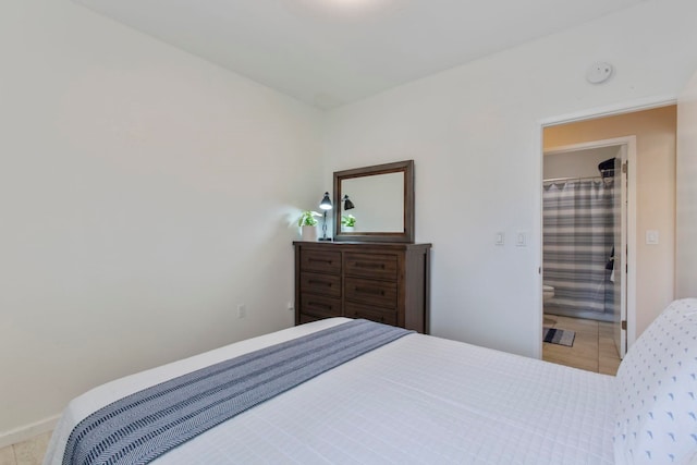 160 Keonekai Rd Unit 11-201, Kihei, HI 96753 - bedroom featuring tile patterned flooring and baseboards