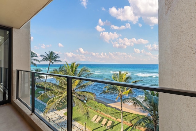 balcony with a view of the beach and a water view