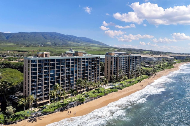 aerial view featuring a beach view and a water and mountain view