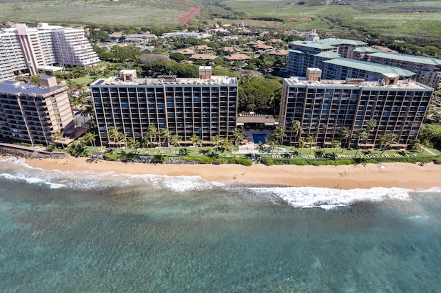 birds eye view of property with a view of the beach and a water view