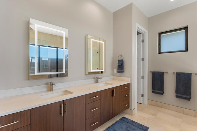 bathroom with tile patterned flooring, vanity, and a shower with door