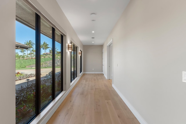 corridor with light wood-type flooring