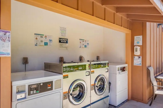 washroom featuring washer and clothes dryer