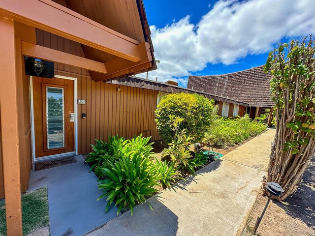 doorway to property with a patio area