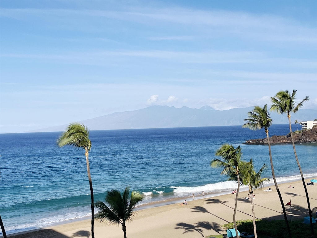 water view featuring a mountain view and a view of the beach