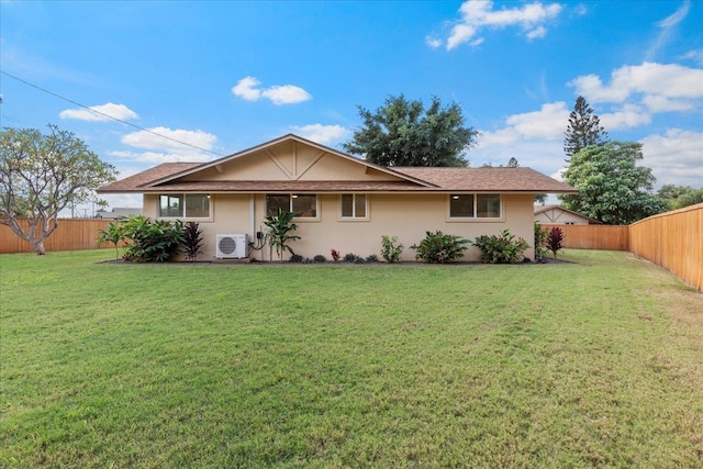 view of front of home featuring a front yard and ac unit