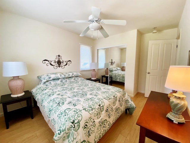 bedroom featuring a closet, ceiling fan, and light hardwood / wood-style floors