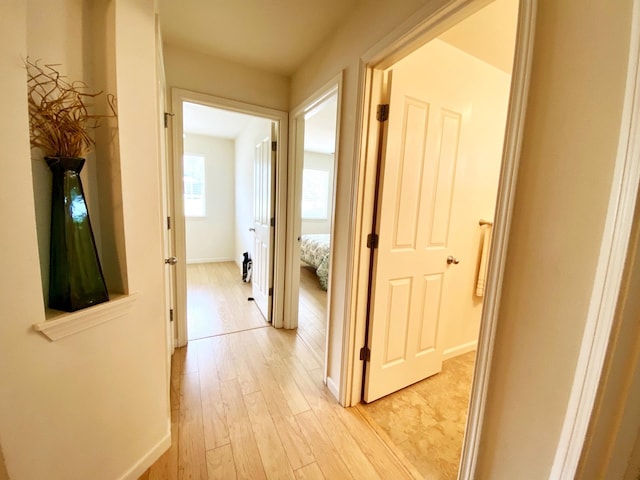 corridor featuring light wood-type flooring