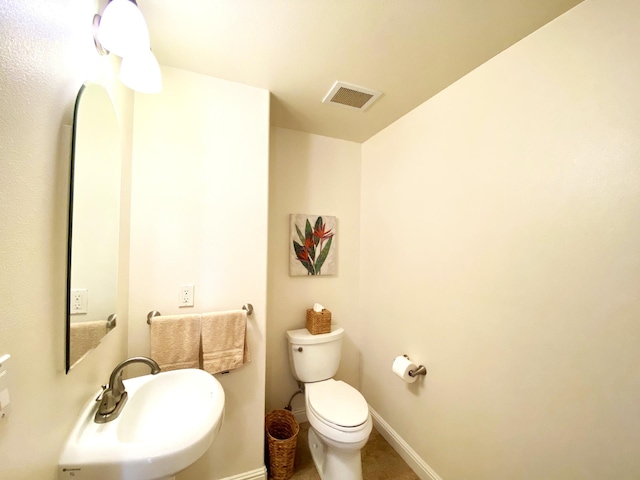 bathroom with toilet and sink