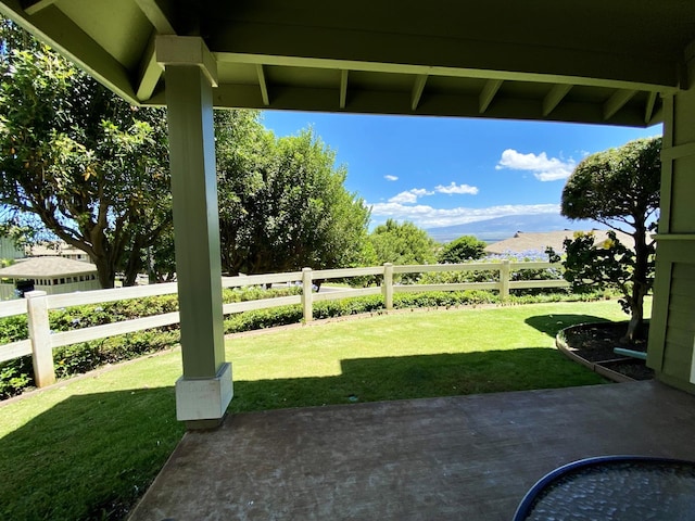 view of yard featuring a patio and a mountain view