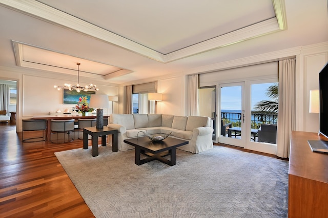 1 Ritz Carlton Dr Unit 1626, Lahaina, HI 96761 - living room featuring a tray ceiling, a chandelier, crown molding, and wood finished floors
